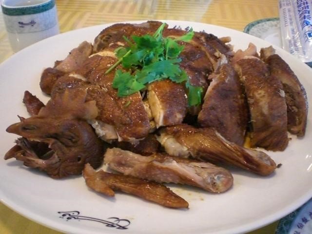 In a restaurant: chicken with head.